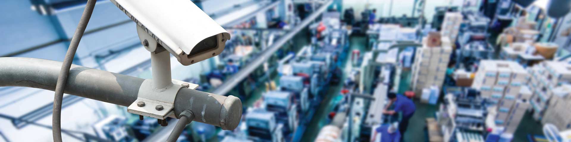 Security camera overlooking busy factory floor.