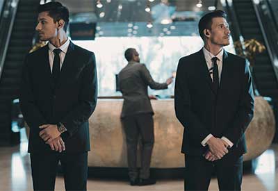 Security guards standing in a hotel lobby