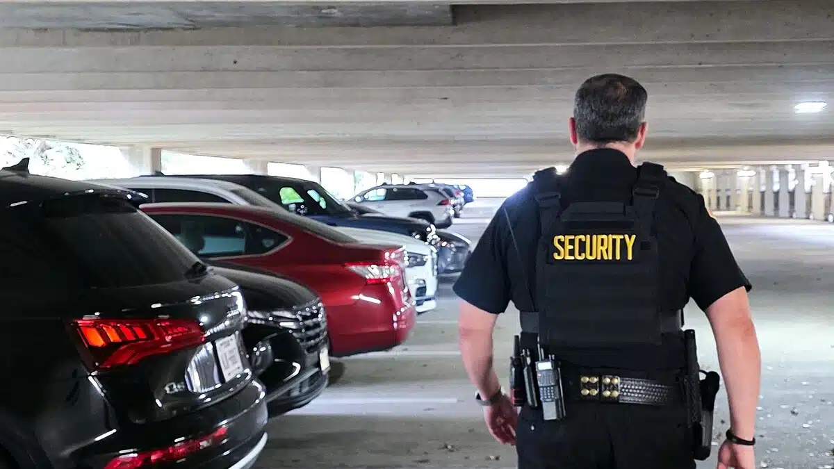 Security guard patrolling parking garage